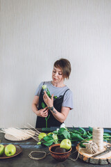 Floral Design Courses Online, Florist business, small business, Flower Arranging, florist trends. Florist woman shows master class, tutorial on creating organic flower fruit edible bouquet