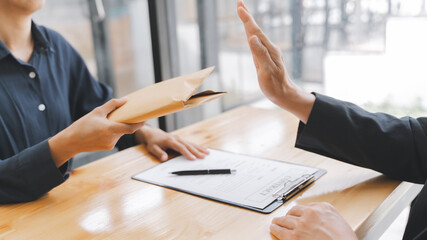 Corruption concept, Business people making a contract with giving a bribery of money. .