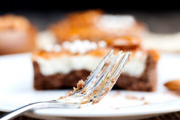 tartlet with milk cheese filling and lots of salted caramel with nuts