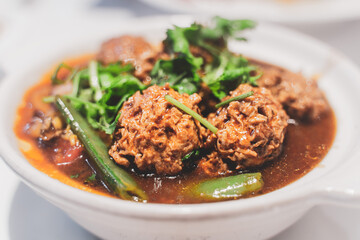 Grilled vegan meatballs with tomato sauce