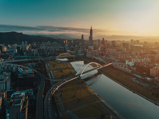 Aerial shot of central Taipei city with Rainbow bridge and Keelung river, Taiwan
