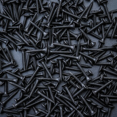 Closeup of  black steel screws background