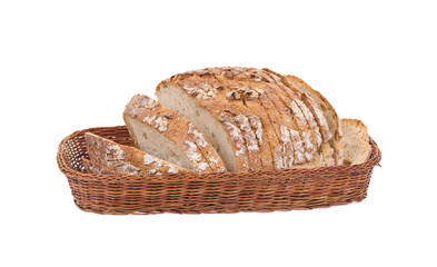 Loaf of sliced bread in basket isolated on white background.
