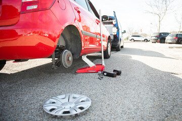 lifted car without wheel.car on the road receiving assistance.car on the road waiting for...