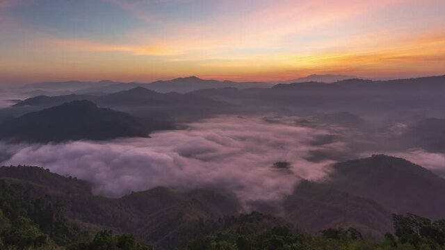 4K Timelapse of beautiful sunrise with fog rolling over mountain in Ai yerweng, Yala, Thailand
