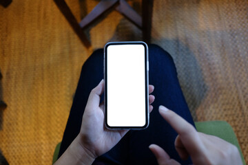 Women's hands holding cell telephone blank copy space screen. smart phone with technology concept.