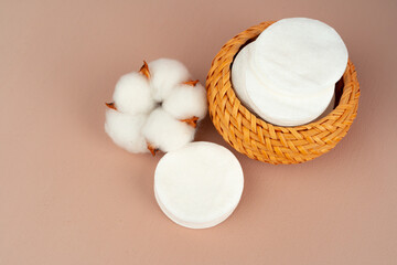Cotton discs for skincare in a jar on paper background