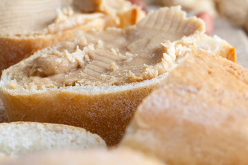 preparing a quick Breakfast of bread and peanuts