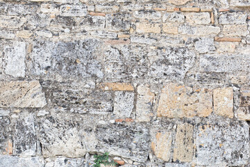 White gray surface texture of an old stone wall in Hierapolis city, Turkey.