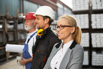 Colleagues working together. Arhitect and workers in factory