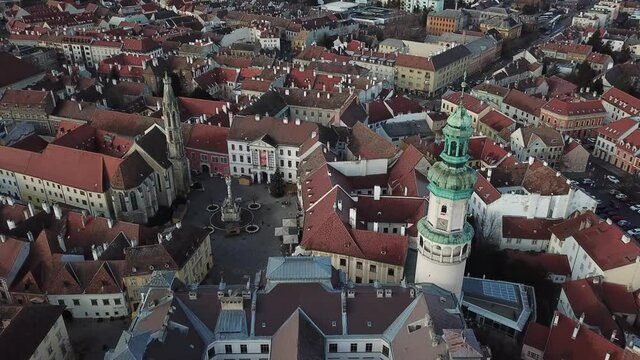 Cinematic aerial drone shot of the charming quaint historical Fire Tower, downtown of Sopron, a major tourist destination in Győr-Moson-Sopron County, Western Transdanubia in Norhwestern Hungary