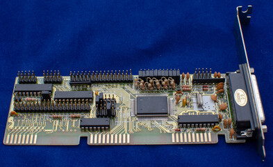 Old computer board with soldered elements