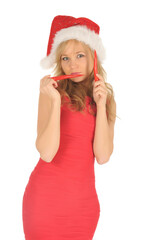 Attractive young woman in Santa Cap with chili pepper. isolated on white