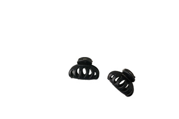 Two little black plastic hairgrips isolated on white background. Women hair accessories
