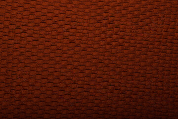 Knit brown fabric texture, background or backdrop. Textile, scarf or sweater textured surface. Warm accessories, clothing, fashion concept.