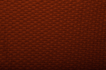 Fototapeta premium Knit brown fabric texture, background or backdrop. Textile, scarf or sweater textured surface. Warm accessories, clothing, fashion concept.