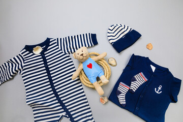 Baby concept. Baby cloth and goods on grey  background. Place for text. View from above. Flat Lay -...