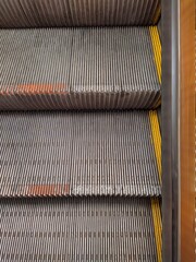 three steps subway escalator close up photo top view