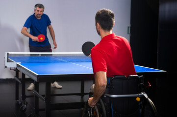 Wheelchair user playing table tennis