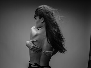 Portrait of woman nude back back view rib model