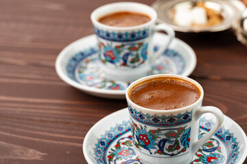 Traditional turkish coffee in oriental dishware close up