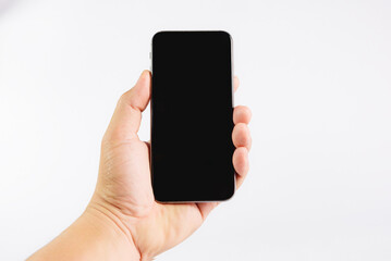 Hand holding phone on white background.