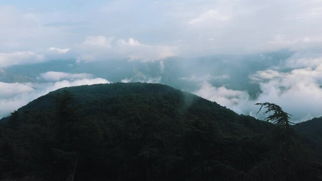 Beautiful landscape of green mountains and sky with clouds.