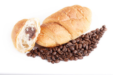 Croissant with coffe beans on white background