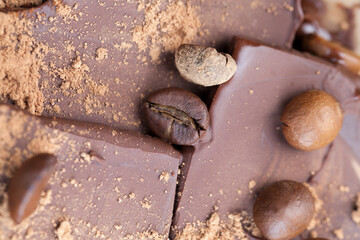 chocolate bar with cocoa powder topping and coffee beans