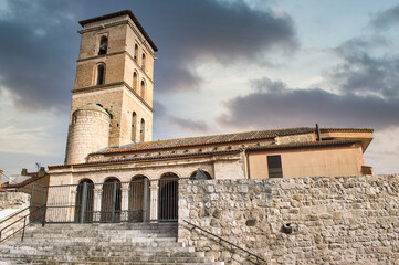 Fototapeta na wymiar Escalinata y reja de acceso a la iglesia parroquial de San Cipriano en Funsaldaña, de estilo gótico mudejar siglo XIII