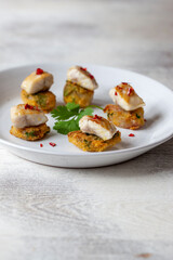 aperitivos y pinchos, tapas de España, berenjena rebozada con pescado. appetizers and pinchos, tapas from Spain, battered eggplant with fish.