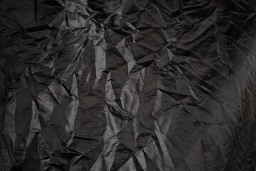 black crumpled storage cover