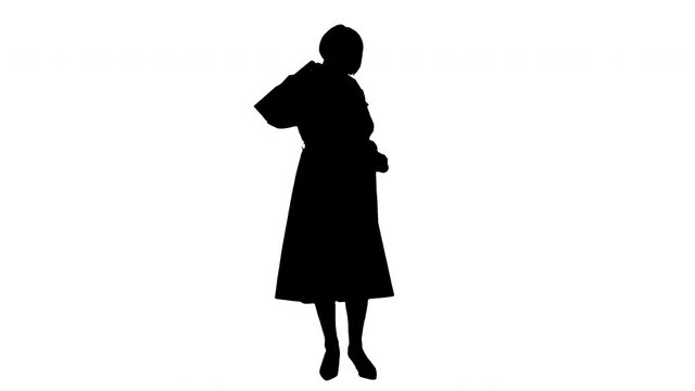 Silhouette Beautiful senior woman in trench coat holding shopping bags.
