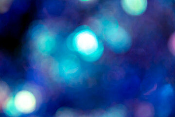 Blue, purple and turquoise bokeh lights. Magic festival color lights. Background or backlight