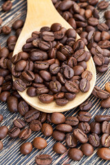 aromatic coffee beans in a wooden spoon