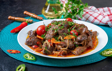 Roast turkey liver with vegetables and herbs. Diet dish