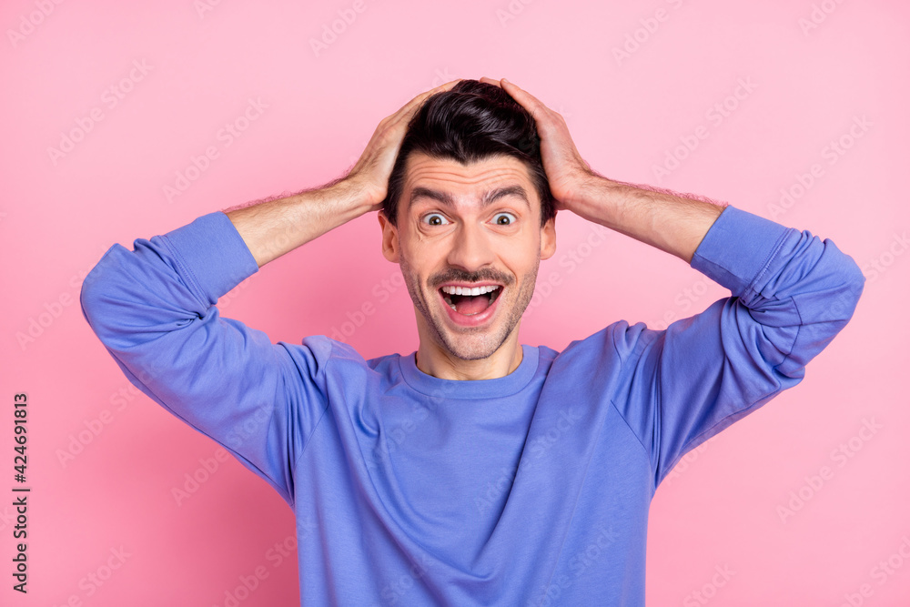 Sticker portrait of impressed cheerful person arms on head open mouth isolated on pastel pink color backgrou