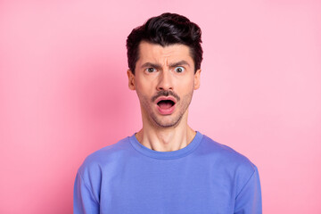 Photo of brunet impressed guy open mouth wear blue shirt isolated on pastel pink color background