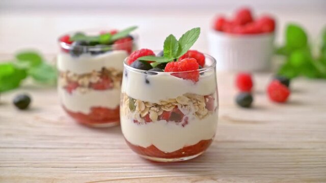 homemade raspberry and blueberry with yogurt and granola - healthy food style
