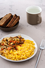 Delicious hearty lunch, pea porridge with cabbage, carrot and meat ragout