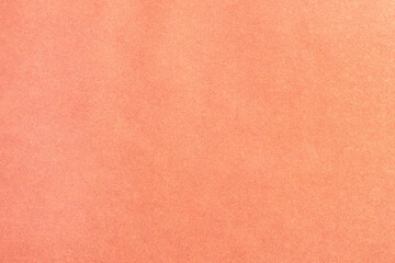 A sheet of colored paper with a non-uniform color. Neutral paper texture.