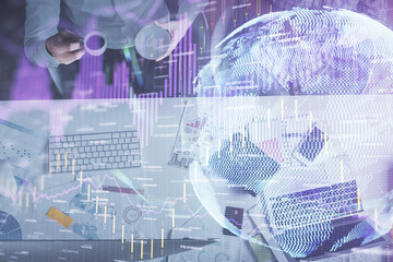 Double exposure of man and woman working together and financial chart hologram drawing. market analysis concept. Computer background. Top View.