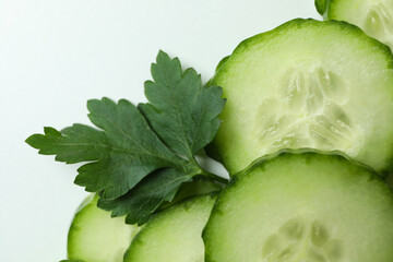 Fresh ripe cucumber slices on white background
