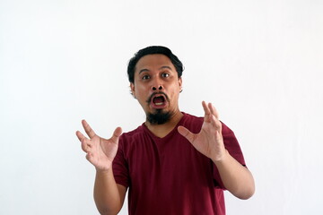 Fototapeta premium fabulous asian man shocked and surprised while looking camera