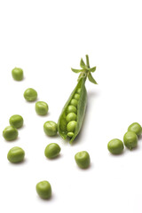Pods of green peas with leaves isolated on white background