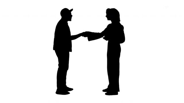 Silhouette African American teens talking and shaking hands.