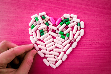 Heart care concept. A lot of pills in a shape of heart
