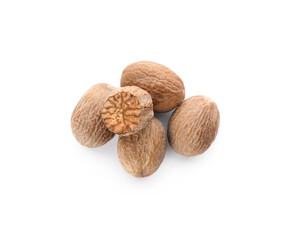 Whole and cut nutmeg seeds isolated on white, top view