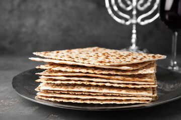 Stack of matzos on grey table, closeup