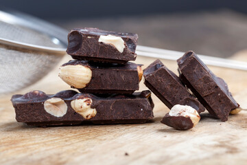 divided into pieces a piece of chocolate from cocoa